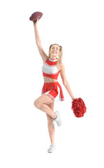 Beautiful young cheerleader with ball on white background