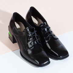 Woman shoes with long shadow on white background