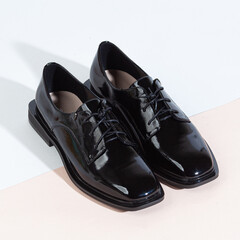 Woman shoes with long shadow on white background