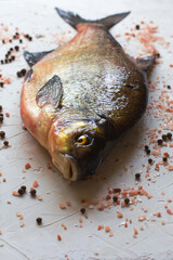Fresh bream on a white table