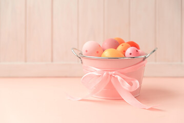 Easter eggs on pink wooden table. Easter celebration concept. Soft focus