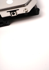 Part of a Sata hard drive for storing information on a white background with space for text. Closeup