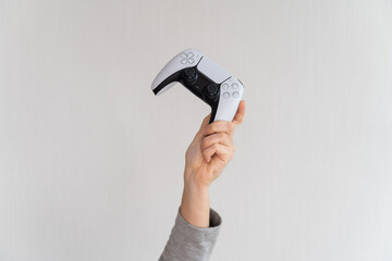 Videogame console wireless gamepad. white lifestyle background. Minimal style. Modern leisure at home.  © troyanphoto