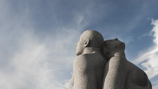 Gustav Vigeland Sculpture Of A Nude Man And Woman Sitting Back to Back At Vigeland Park In Frogner Park, Oslo, Norway. - low angle, hyperlapse
