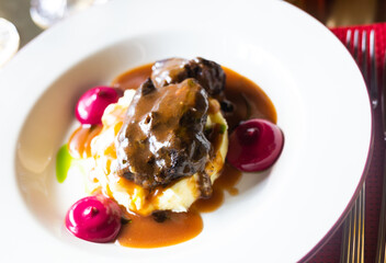 beef cheek with mashed potatoes and currant oil