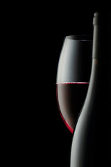 the contours and curves of a bottle and a glass of red wine. a concept for decorating a wine shop or restaurant - obrazy, fototapety, plakaty