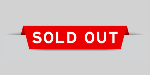 Red color inserted label with word sold out on gray background
