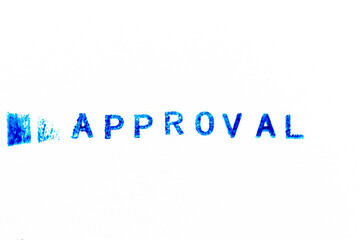 Blue color ink of rubber stamp in word approval on white paper background