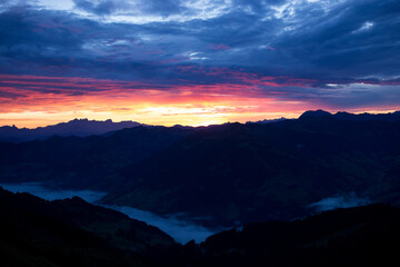 Early morning in the mountains. The sun rises over the mountains. Dawn in the mountains.