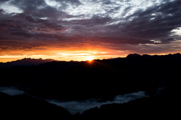 Early morning in the mountains. The sun rises over the mountains. Dawn in the mountains.