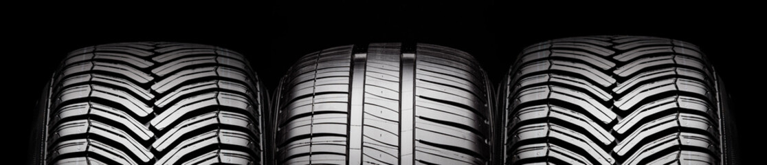 summer and all-season tires, front view tread on black background