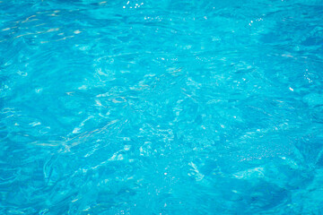 blue pool water in the summer in the warm season, background, place for text