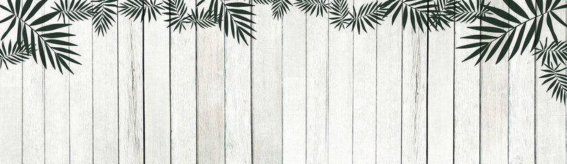 The Old white wooden lath and green leaf pattern texture background.