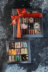 Assortment of chocolates, white, dark and milk chocolate. Festive boxes with chocolate and multicolored.