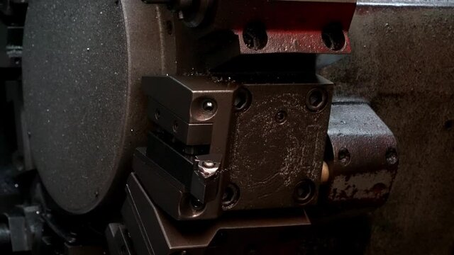 turret head in black for setting various drill bits.The hi-technology metal working process by CNC turning machine.