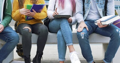 Cinematic footage of four students making activities outdoor after school. Multiethnic group of teenagers having fun together