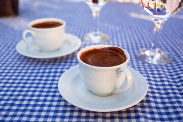 Fototapeta na wymiar Traditional turkish coffee with a glass of water. Morning atmosphere.