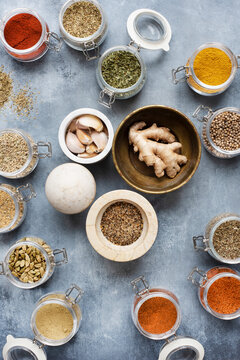 Spice jars with fresh ginger and garlic
