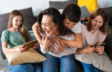 Happy multiethnic family and ethnicity concept. Asian mother with children