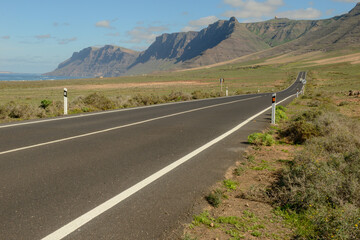 Fototapeta premium Road to Famara beach at Lanzarote on Canary islands, Spain