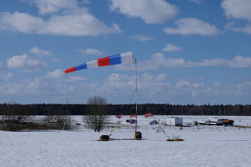 A windsock is on the snow field.