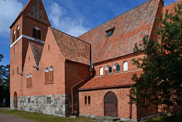 brick neo-gothic Catholic church of Our Lady of Gietrzwałd, erected at the beginning of the 20th century, in the village of a gentry cauldron in Masuria, Poland
