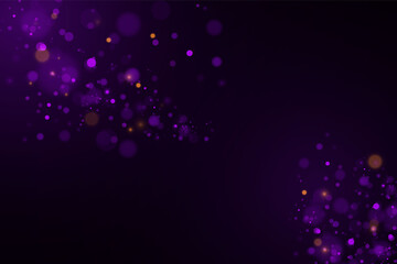 Sparkling magical dust and purple blue particles on black background.