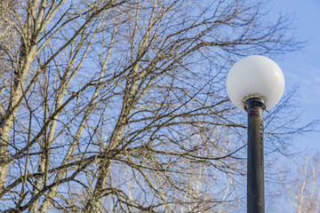 Vintage iron lantern in a public park in the daytime