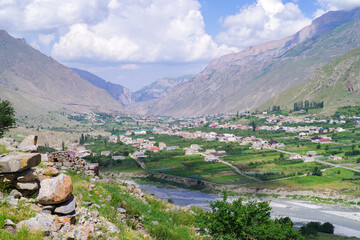 Fototapeta na wymiar View from the mountain to the village of Verkhnyaya Balkaria and the Cherek valley