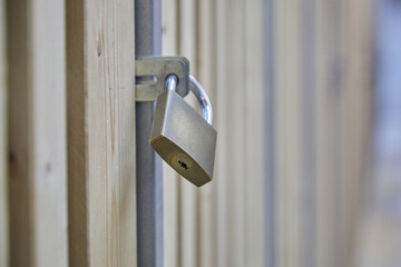 Padlock on cellar door. Secure your basement compartment with a lock. Safety first. Indoor.