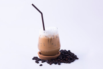 Coffee cup and coffee beans on wooden table.