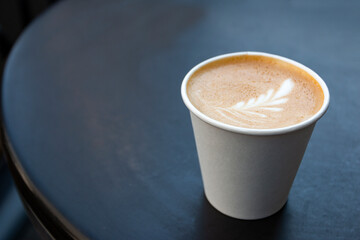 Above view of cup of coffee with latte art 