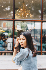 Smiling lady women sitting in art loft coffee shop