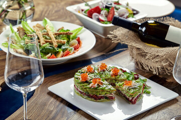 Beautifully decorated catering banquet table with different food snacks and appetizers