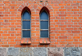 Fototapeta na wymiar brick neo-gothic Catholic church of Our Lady of Gietrzwałd, erected at the beginning of the 20th century, in the village of a gentry cauldron in Masuria, Poland