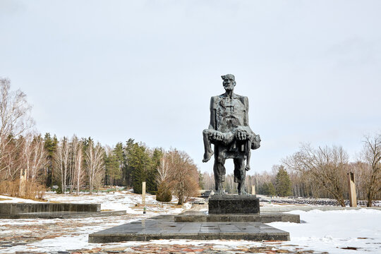 Khatyn, Belarus - March 13, 2021 Memorial complex. Sculpture - The Unconquered Man - father and dead son. Victims of the Second World War. Symbol of the mass destruction of civilians by the Nazis