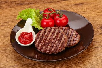 Grilled burger cutlet with sauce