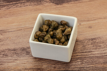 Tasty capers in the bowl