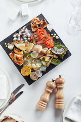 seafood platter. Assorted delicious seafood with vegetables. White background