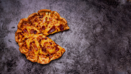 Four Cheeses Pizza And bacon, on black concrete, with space, for text, content In view of the pizza's top.