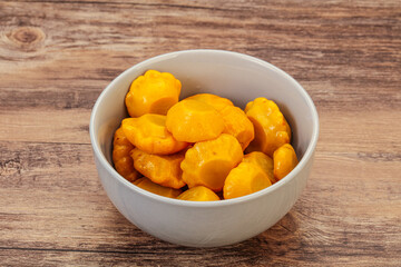 Marinated yellow patisson in the bowl