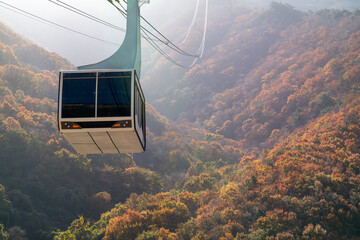 Famous cable car and autumn foliage scenery in Miryang, South Korea.