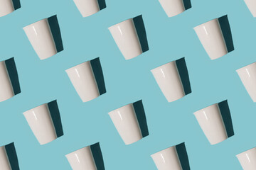 Seamless pattern with porcelain cup coffee to go on blue background,