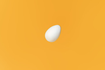 White egg flying on yellow background, easter concept. Preparing for Christianity holiday Easter. Happy easter card. Copy space for text
