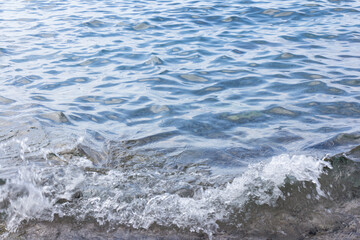 Sea surface with small waves, in blue and turquoise color tones