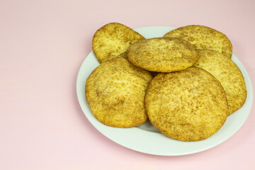 heap of snickerdoodle cookies with sugar and cinnamon