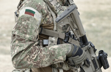 Soldier with assault rifle and flag of Bulgaria on military uniform. Collage.