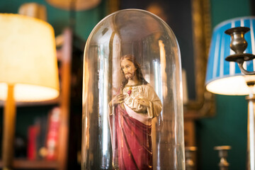 Small vintage statuette of Christ in a glass dome