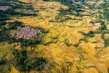 Aerial view of farmland and cloudscape of Yuanyang Terrace Scenic Area