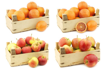 Fresh fresh "Sissi red" apples, red and yellow apples  and blood oranges in a wooden crate on a white background